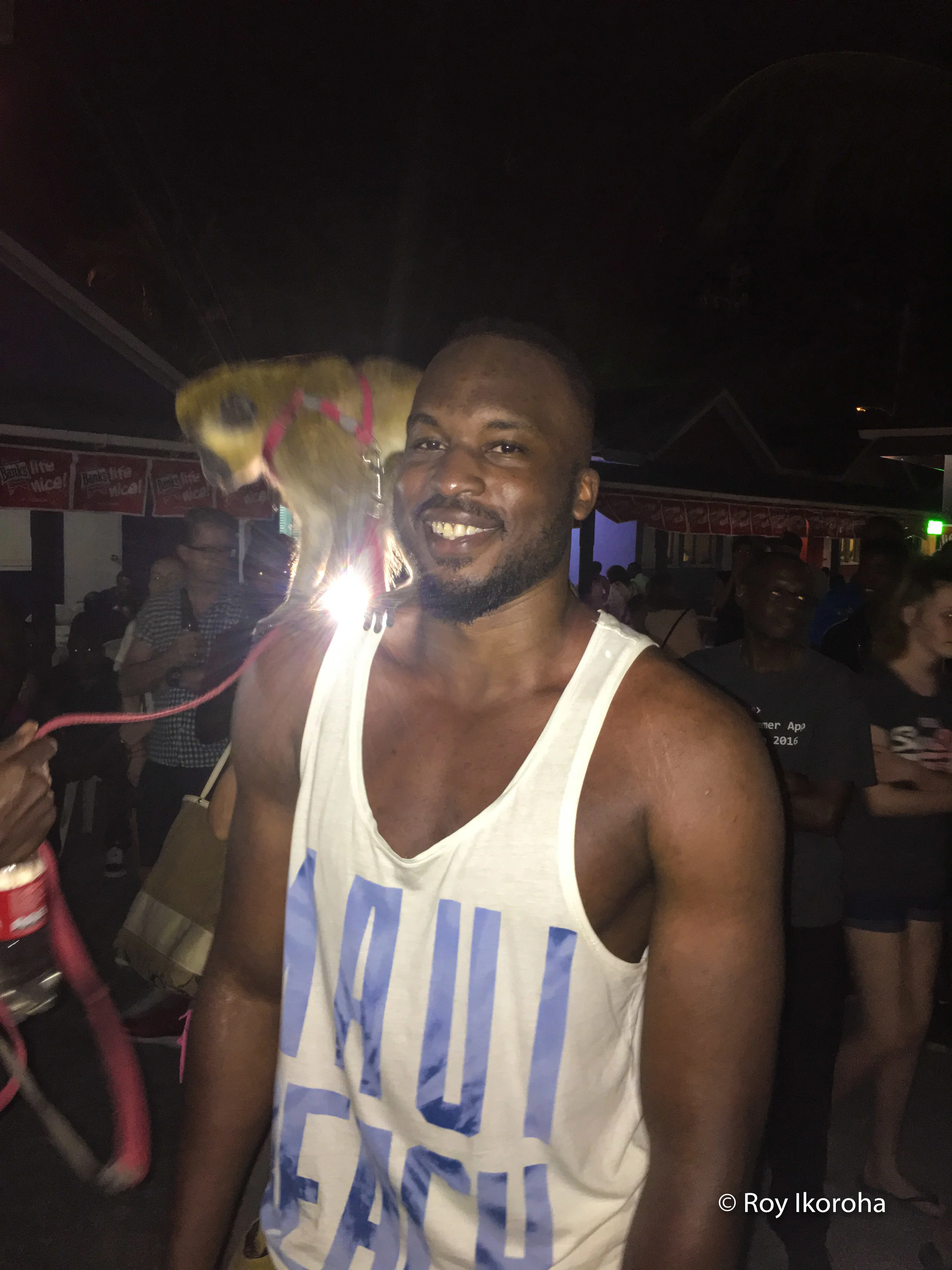 With a baby Monkey at an Oistins festival, Barbados