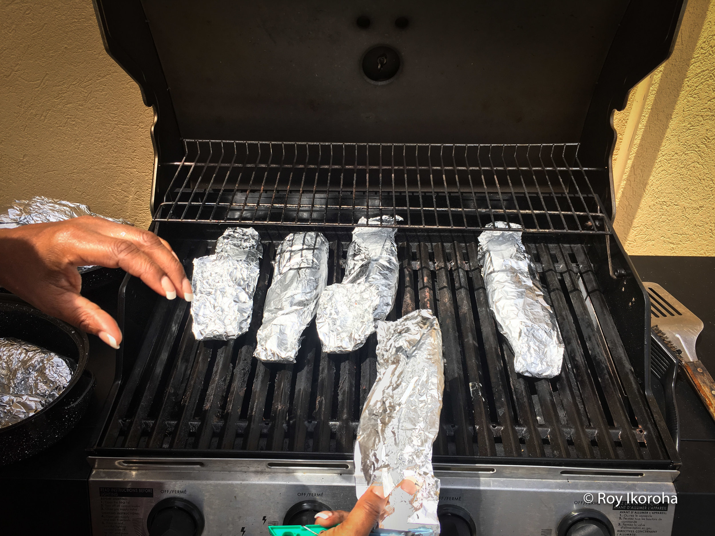 Barbecuing the fish in the villa's backyard