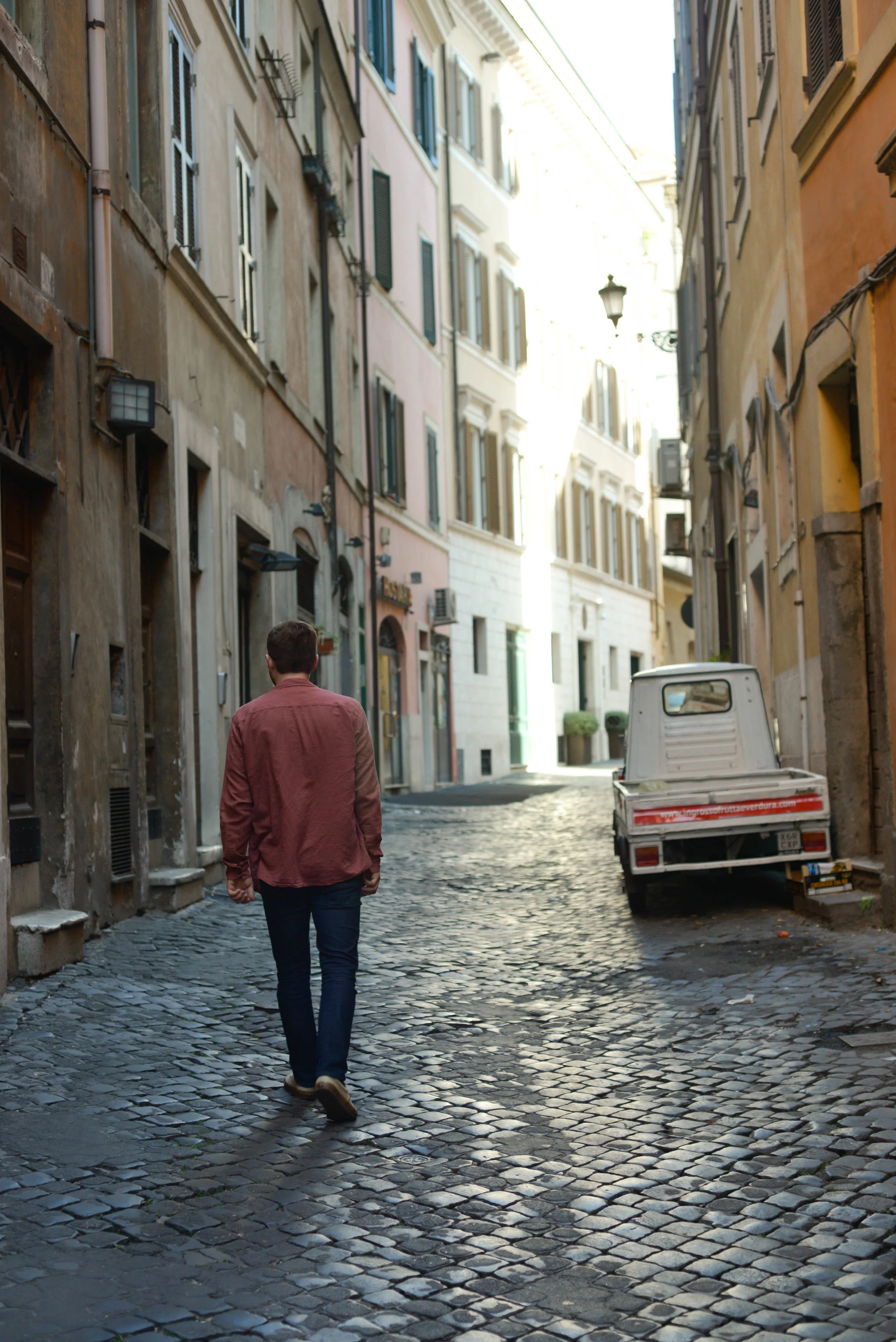 Jack strolling up an empty street on our first day Rome | Photo by Lauren Caron © 2017, A Layered Life Travels. 