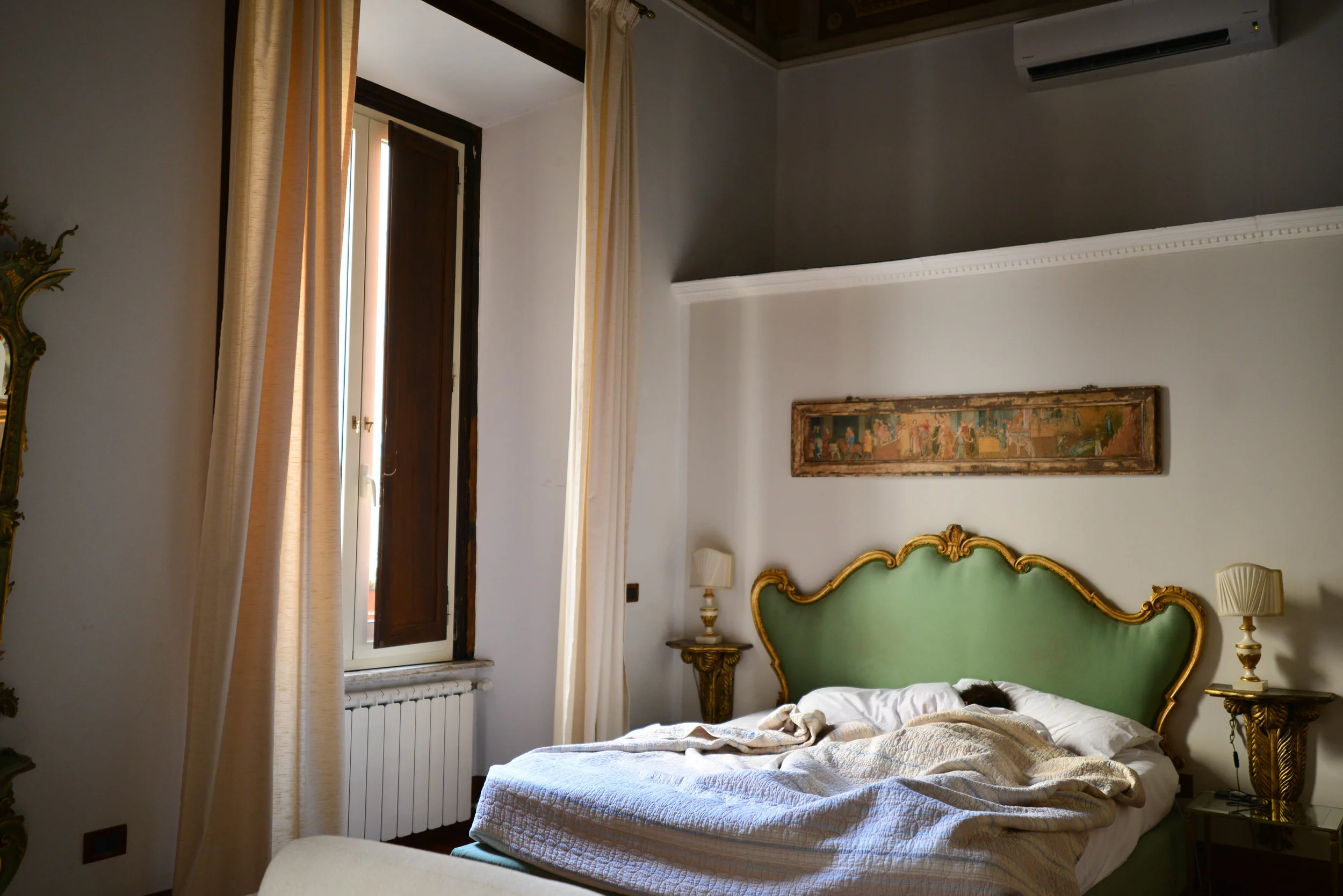 Jack asleep in the bed of the studio in Rione Regola | Lauren Caron © A Layered Life 2017