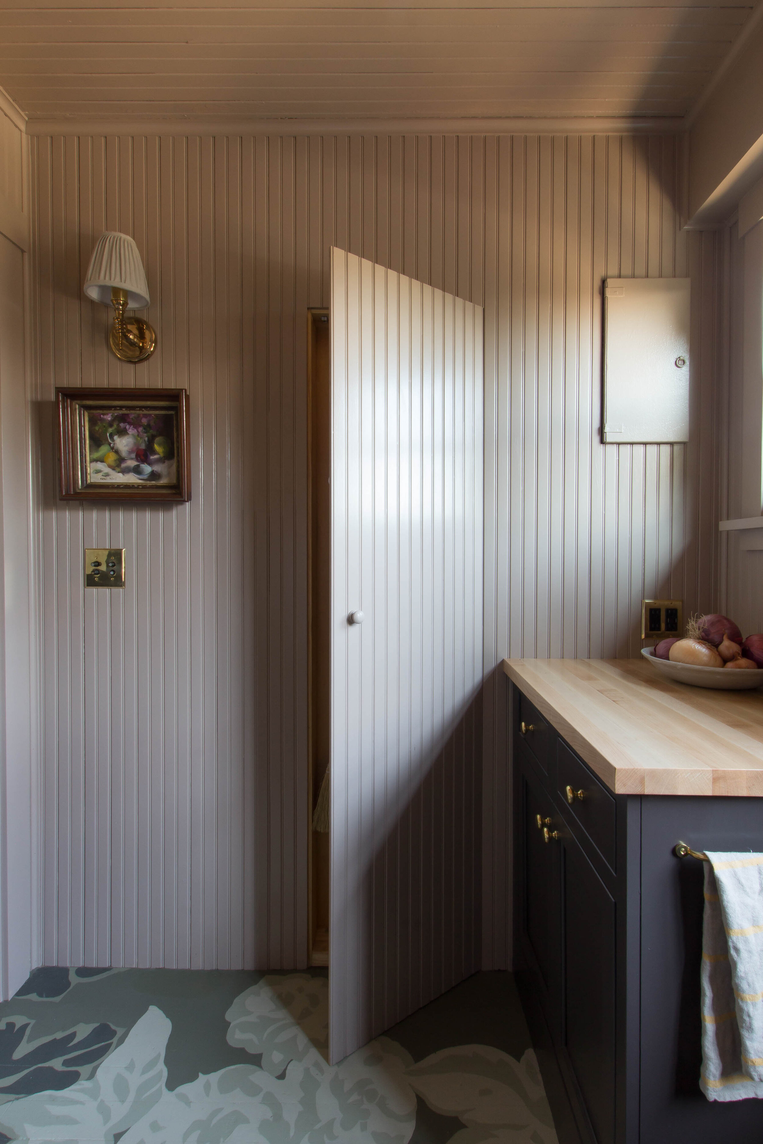  Seattle Scullery Designed by: Studio Laloc, Lauren L Caron - Photo by: Lauren L Caron © 2020  The beadboard paneling perfectly disguises the broom closet door. 