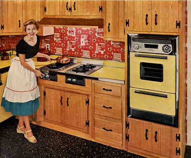 WAY BEFORE: The vintage "Caloric kitchen" with planked oak cabinets reminiscent of those in the Perl Residence