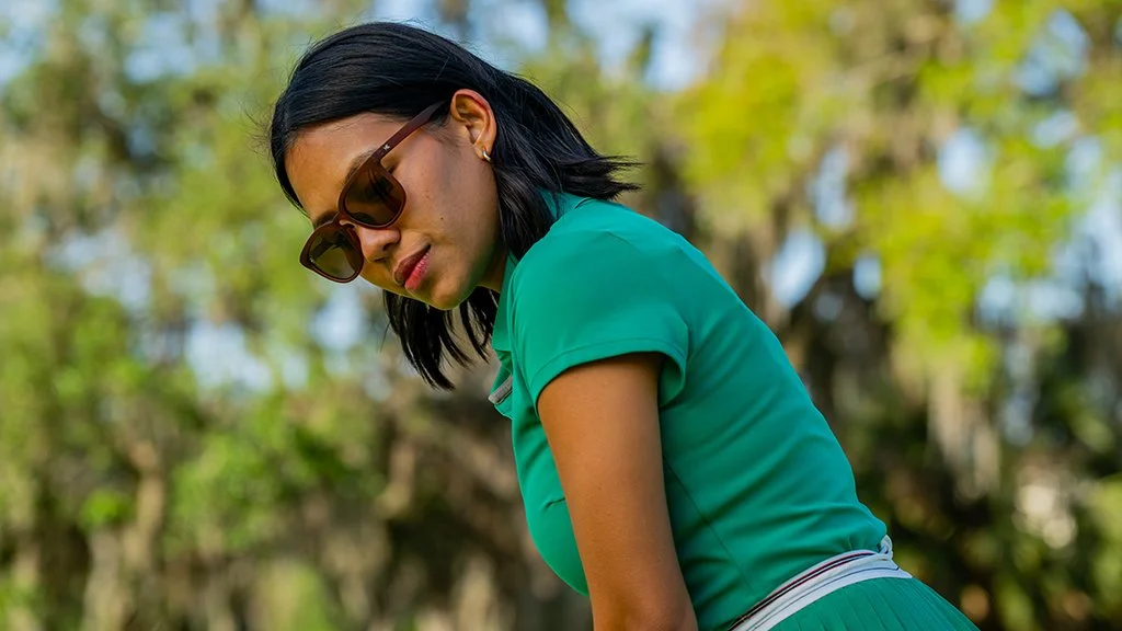 female-golfer-portrait-green-outfit-golf-course-lifestyle.JPG