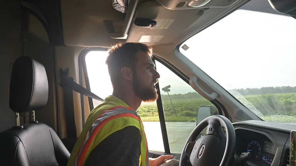 Avery LeGrand driving the production van while the drone team chased the CSX America 250 Executive Train through the Southeast.
