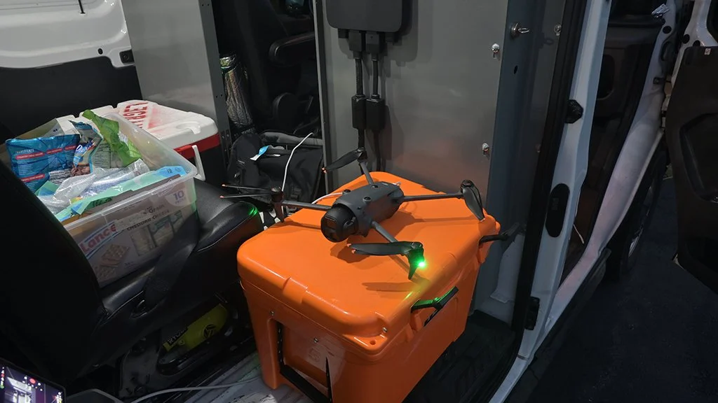 DJI Mavic 4 Pro staged on a hard case inside the production van between drone flights following the CSX America 250 Executive Train.