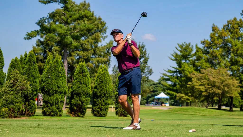 Retired U.S. Air Force Lieutenant General Steven Basham hits a tee shot during the Pars With Patriots Invitational.