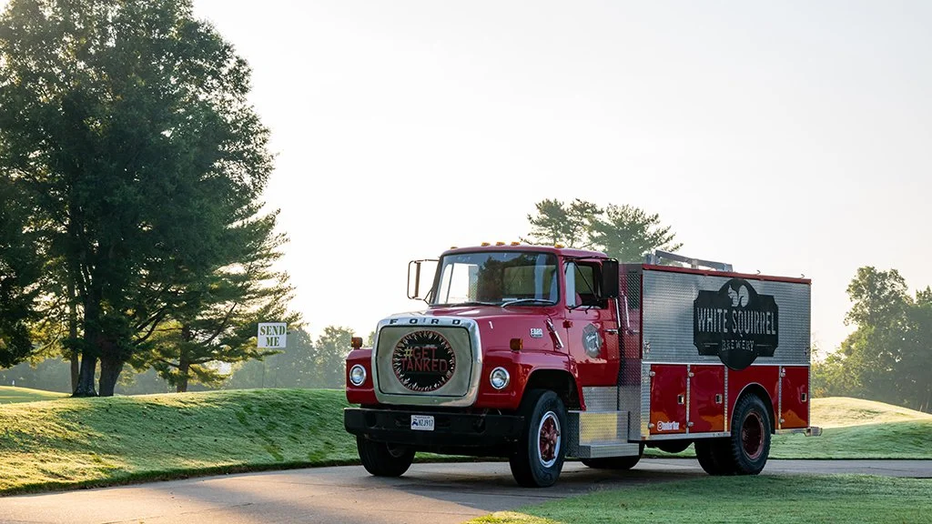 White Squirrel Brewery's restored firetruck mobile bar at the Pars With Patriots Invitational in Bowling Green, Kentucky.