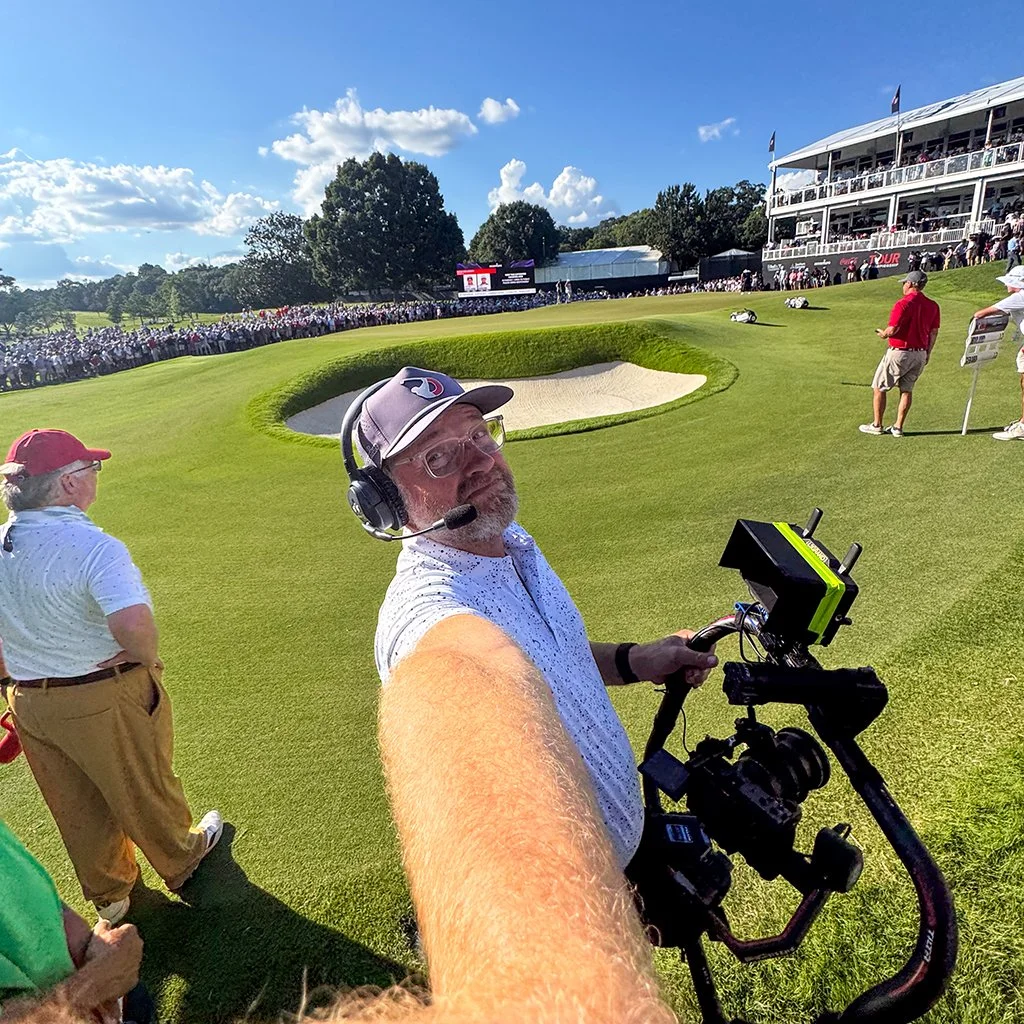 Michael LeGrand working with a camera gimbal during the PGA TOUR Championship at East Lake Golf Club in Atlanta.