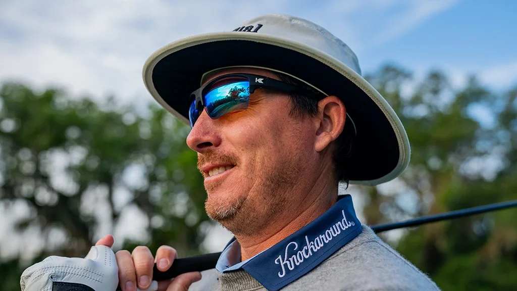 PGA Tour golfer Joel Dahmen carrying club over shoulder during lifestyle golf photoshoot