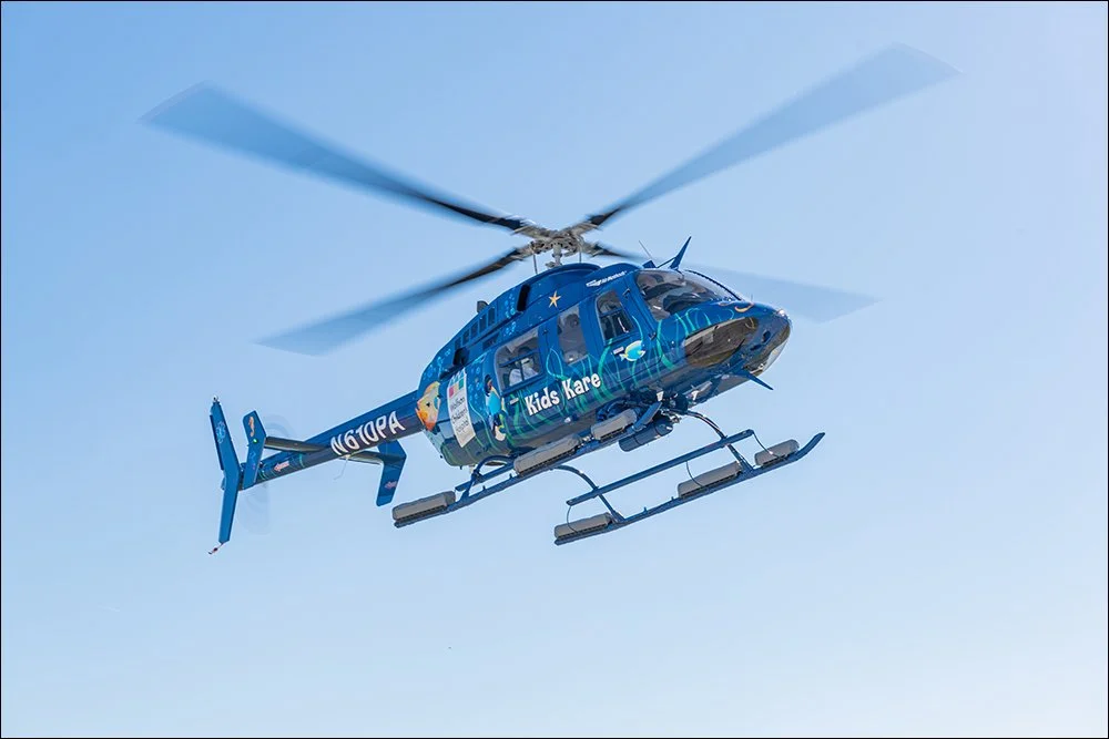 Medical helicopter in flight providing air ambulance transport services