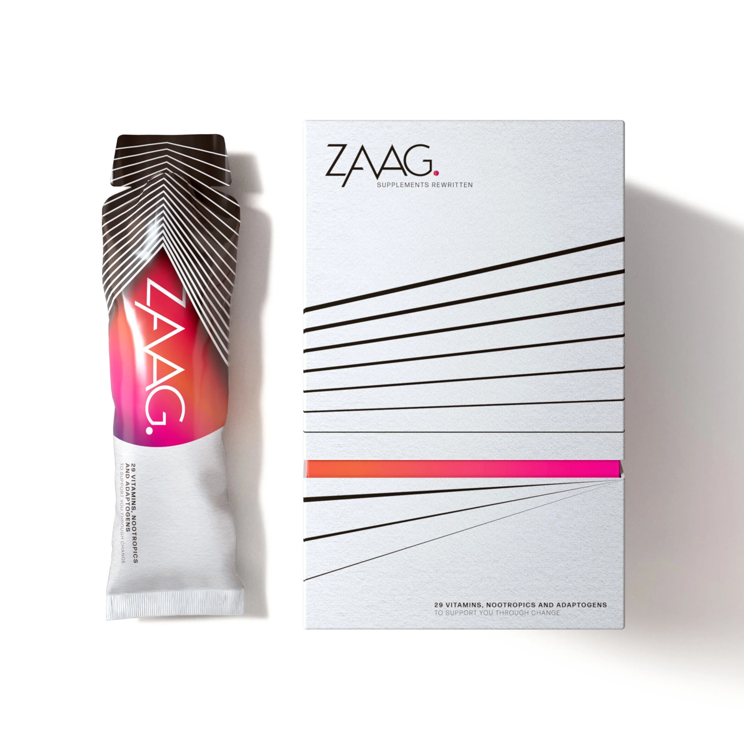 A white box with black diagonal lines and the word 'ZAAG' printed on it, placed next to a black and white box with the label 'SUPPLEMENTS REWRITTEN', and a tube with a colorful gradient design and the word 'ACID' on it.