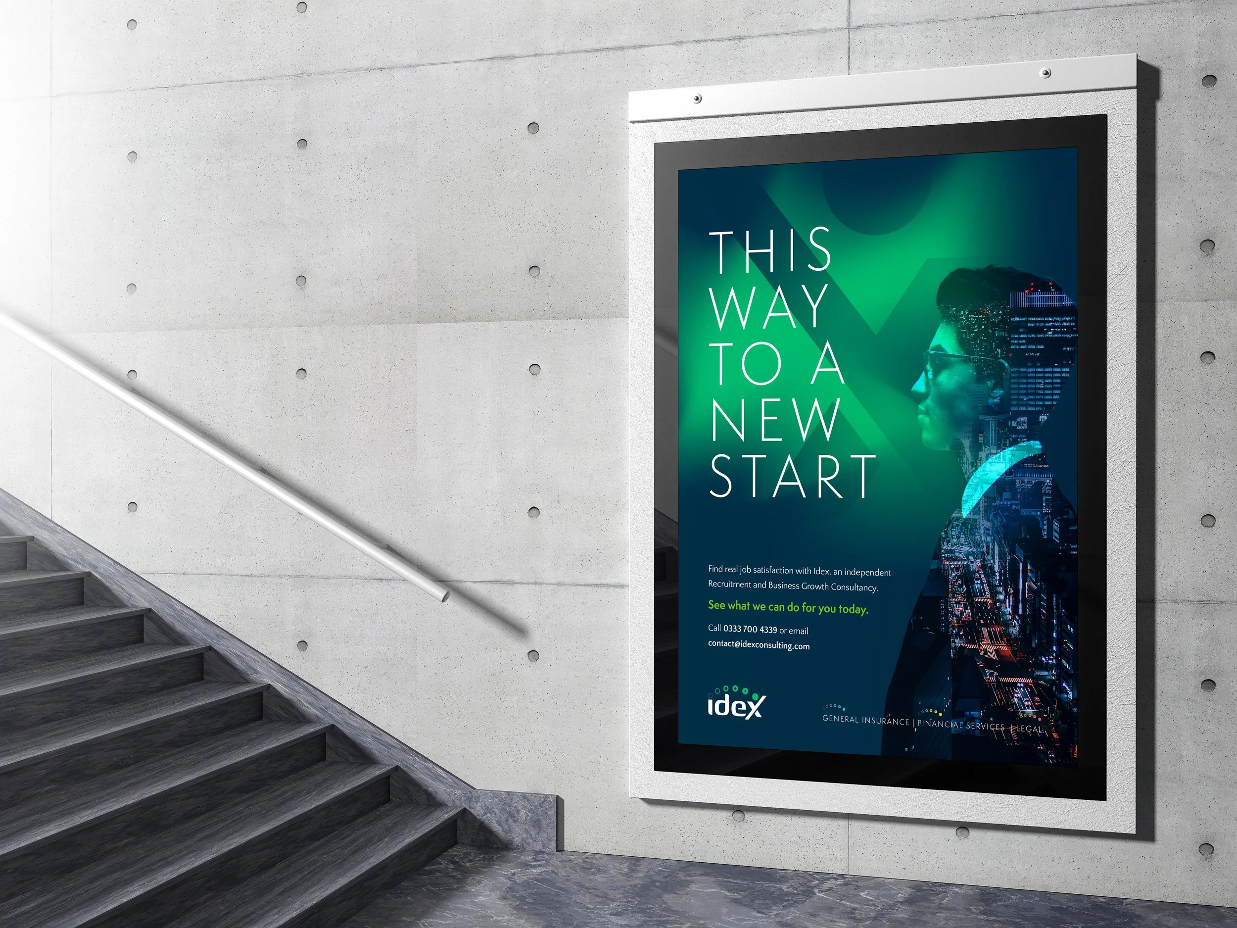 An advertising poster on a wall at the bottom of a staircase with concrete walls and steps. The poster features a woman wearing glasses with a cityscape reflected in her profile and text saying "This way to a new start."