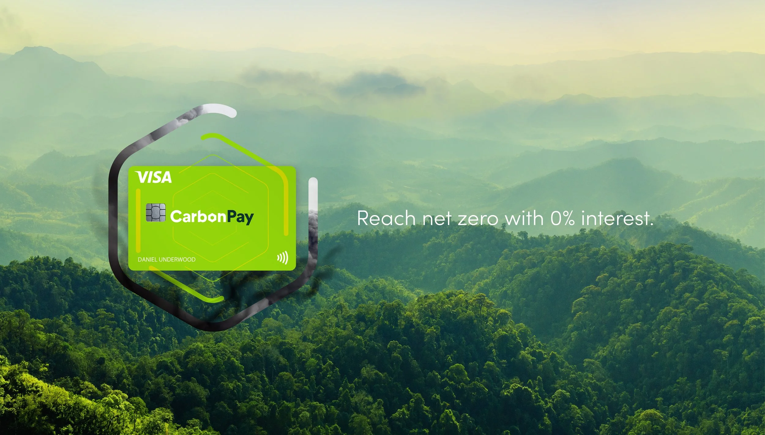 An advertisement for CarbonPay Visa card featuring a background of lush green mountains and a message that reads "Reach net zero with 0% interest." The card appears to be glowing with green and white colors and has the name Daniel Underwood.