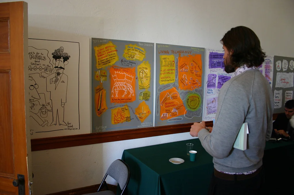 Conference attendee reviews paintings