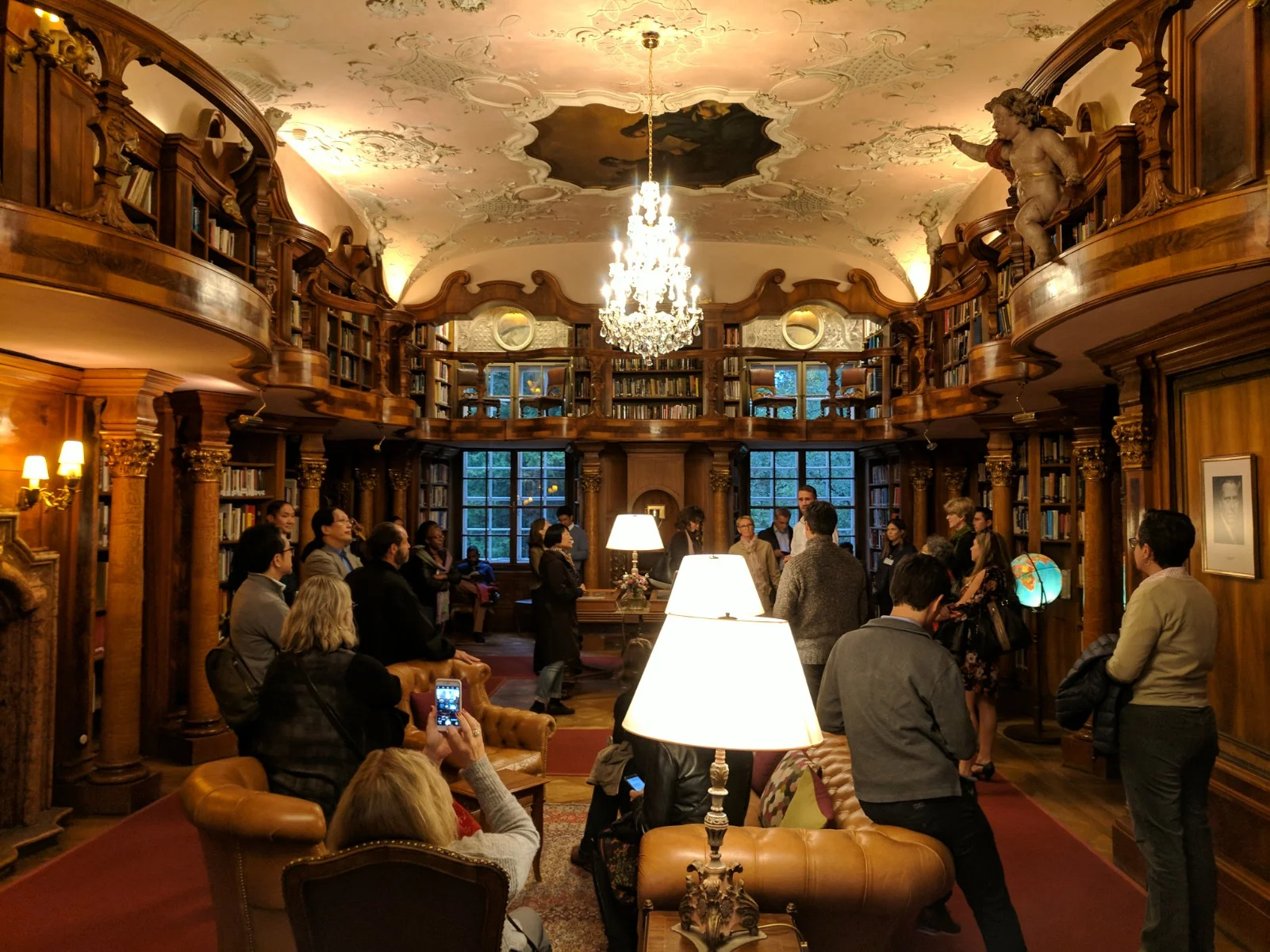 Seminar attendees in the Schlosse's incredible library.