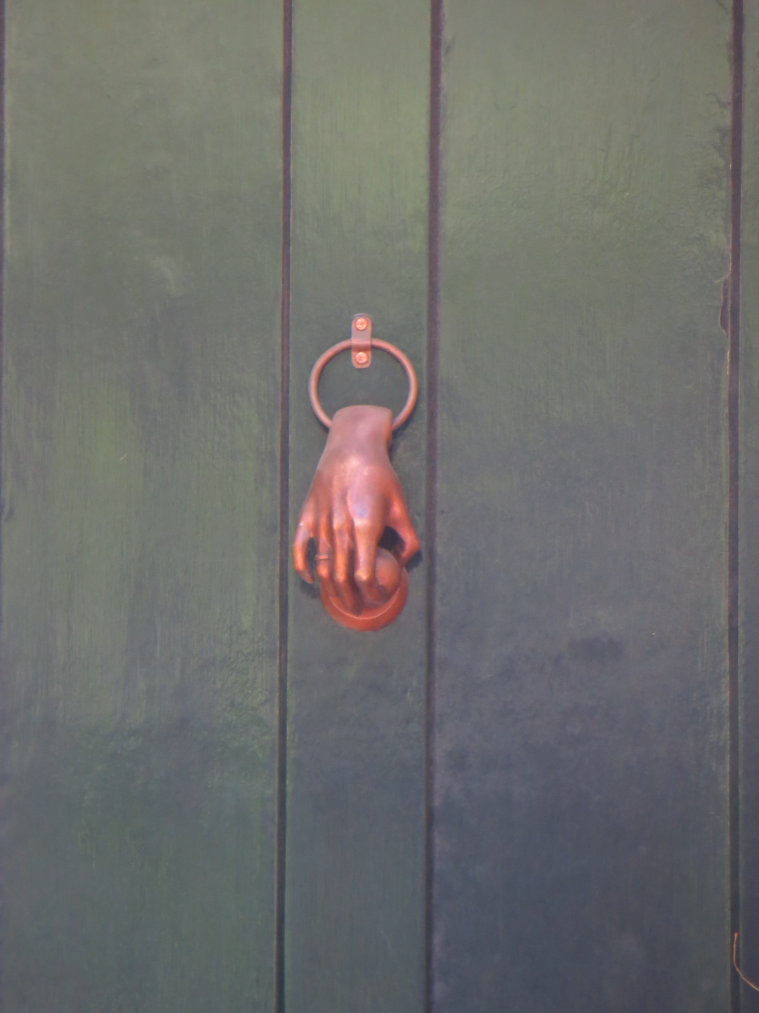 Disembodied hand knocker