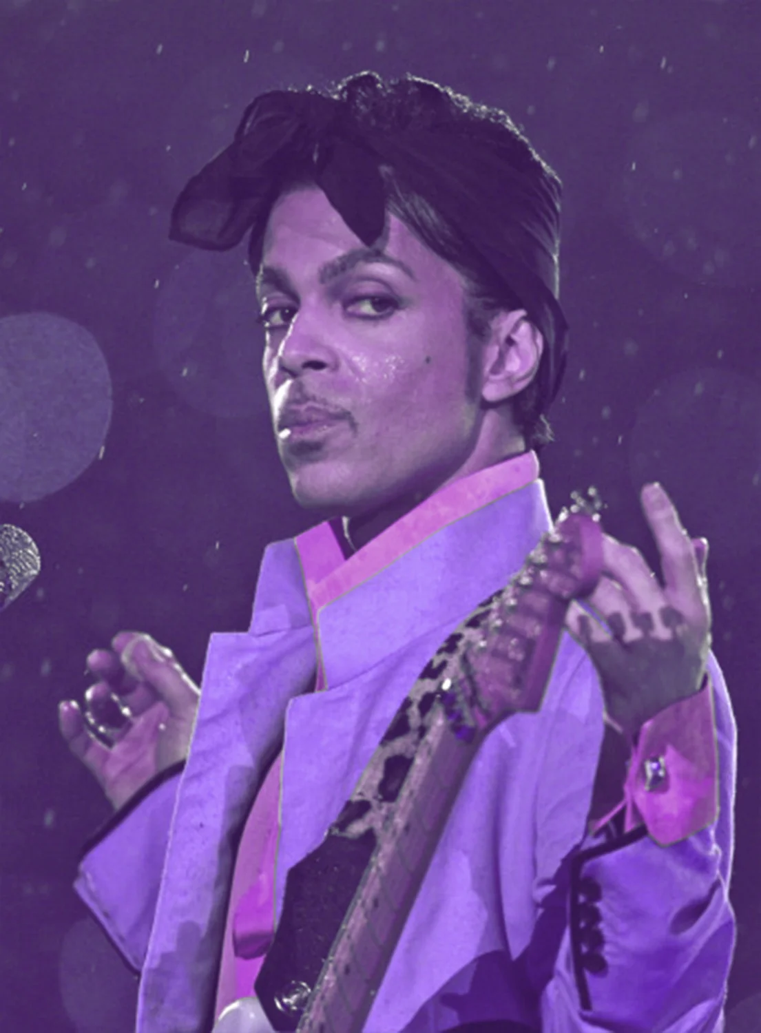 Prince performing "Purple Rain" amongst the raindrops during the Super Bowl XLI Halftime Show.