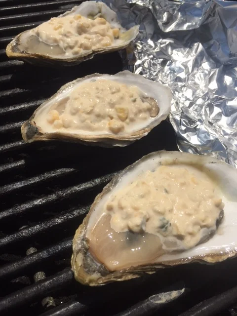 Support the bill of the oysters with a row of foil to prevent any spillage