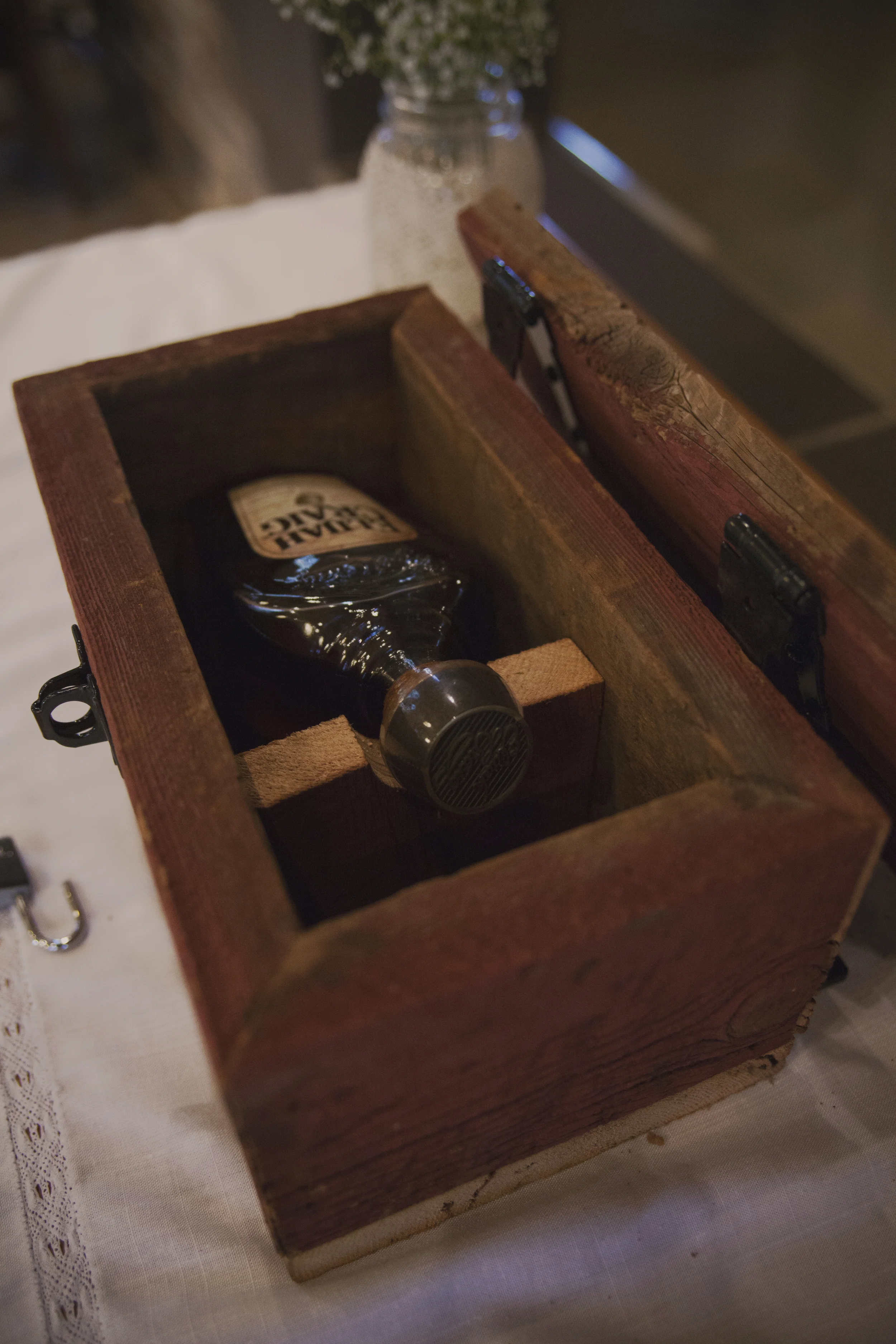 A handmade box made by family to put future letters and a drink for the couple
