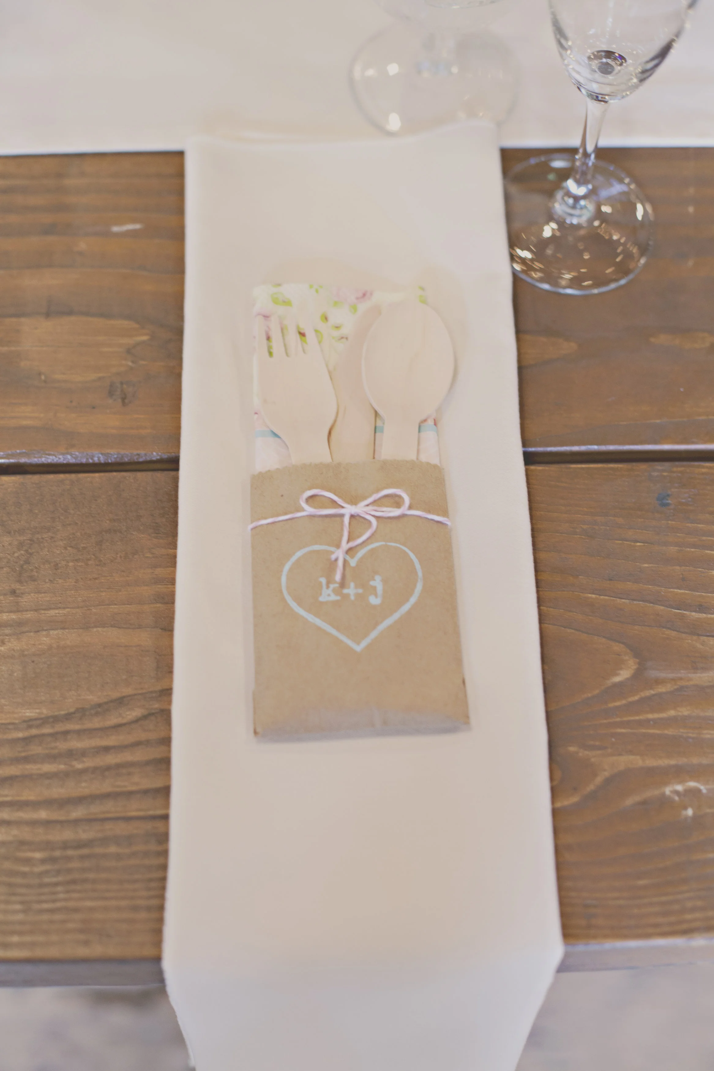 Wrap up cute wooden utensils instead of real silverware at guest's place settings
