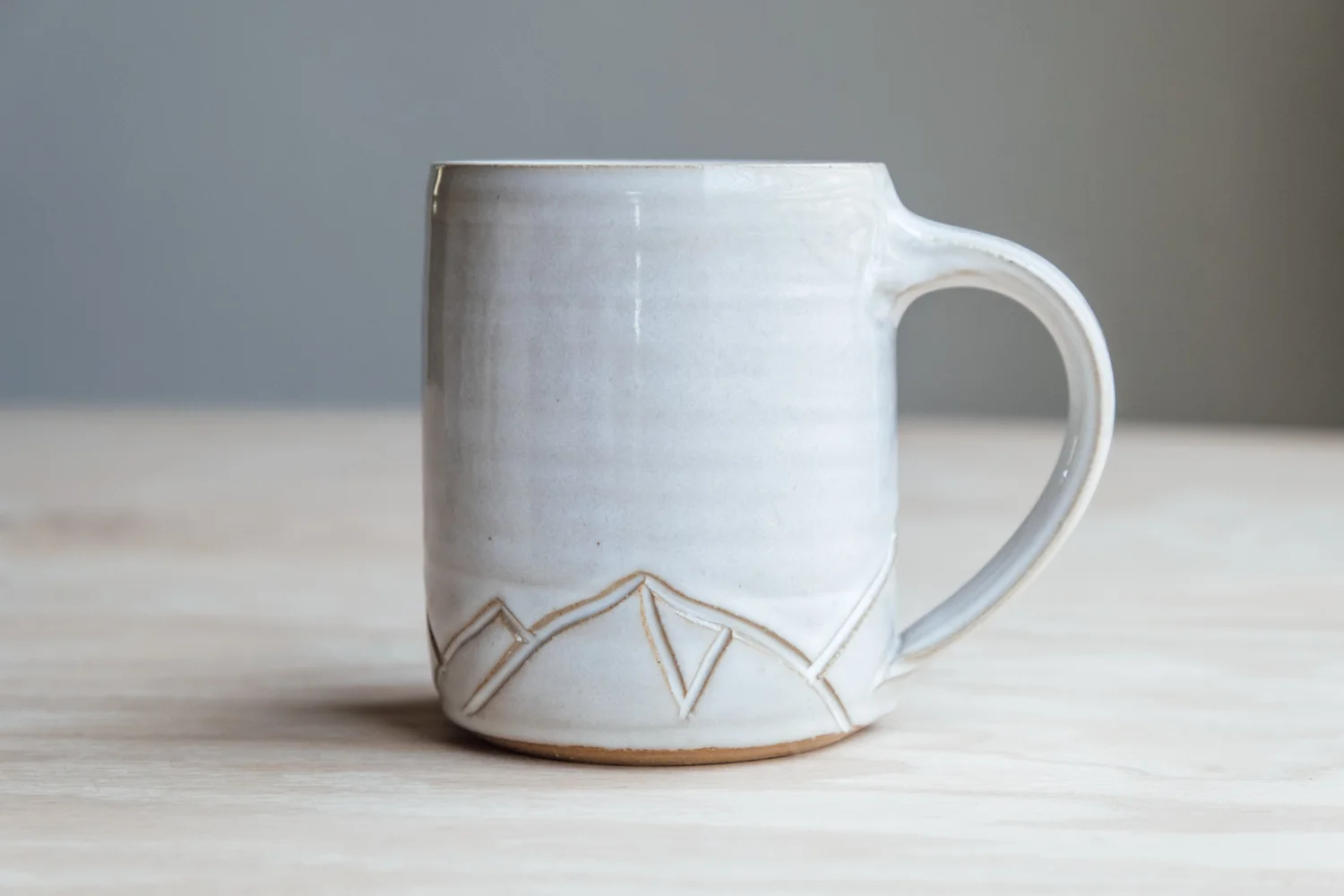 Mountain Mug - Eggshell $16.50 Wholesale | $28 MSRP Approx. 3.75" tall x 3.25" wide, 12 oz