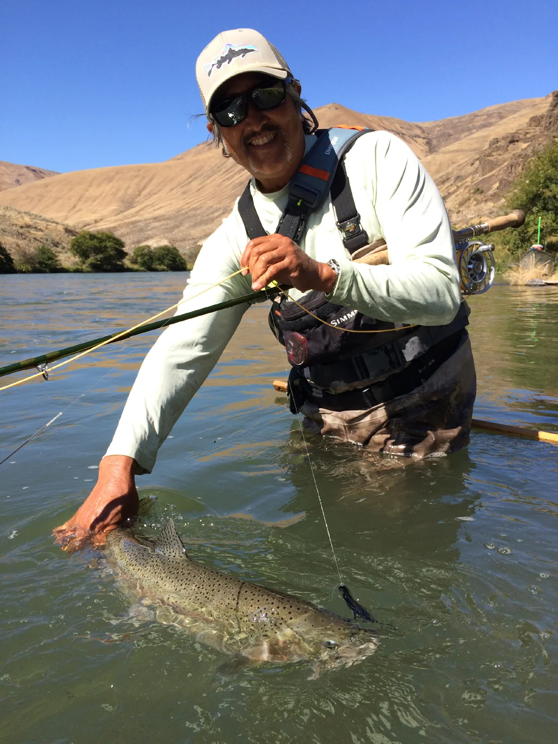 Victor Inouye tailing one of three fish he hooked in 20 minutes. They are where you find 'em! I believe this was Victor's most productive trip with us despite unfavorable river conditions.