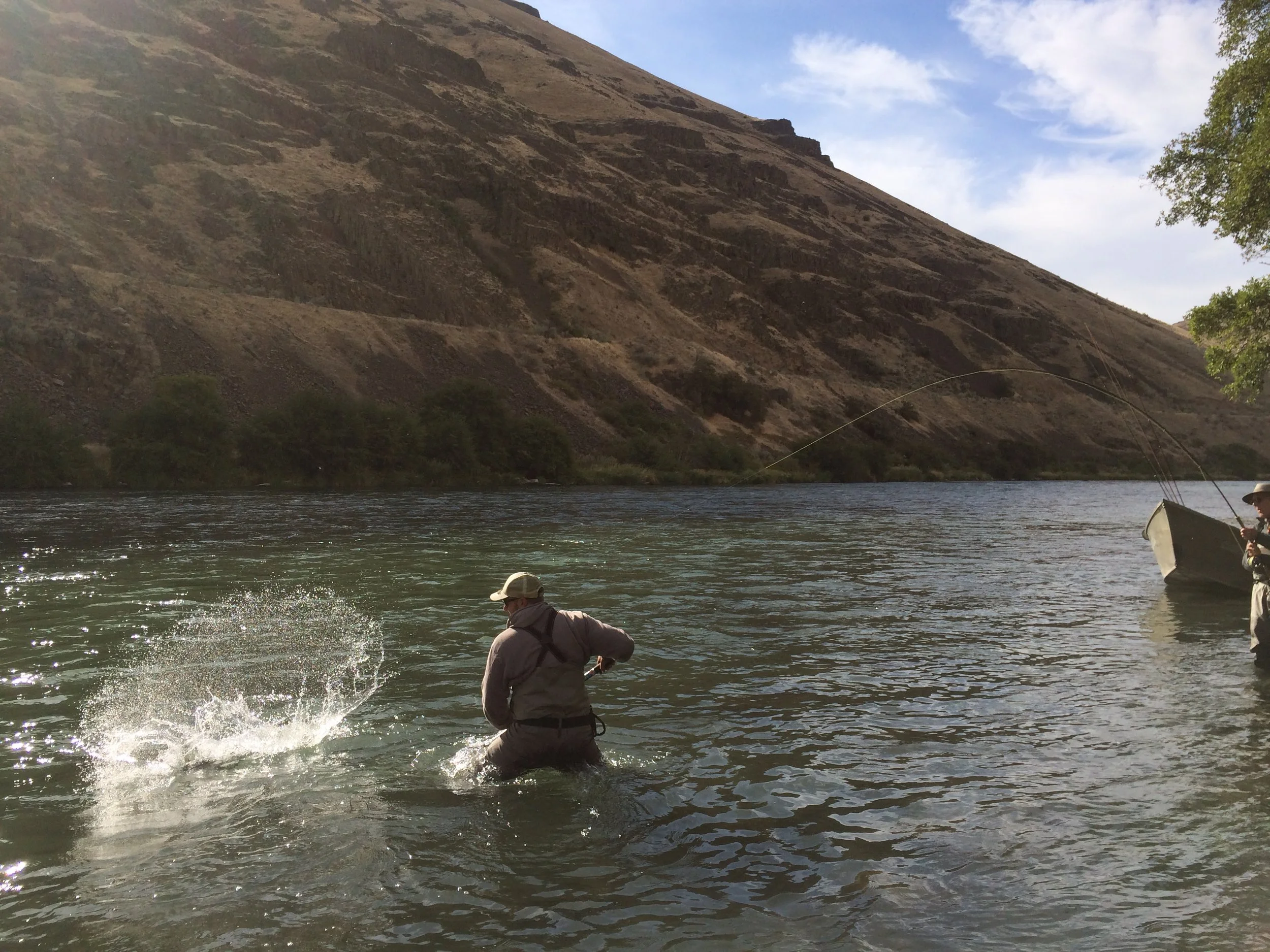 Nick Rowell helping Jum DeLacy close the deal on his first dry fly steelhead.