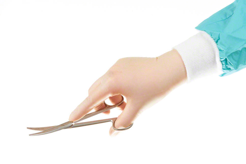 Surgical instrument (mayo scissors)  held by surgeons hand