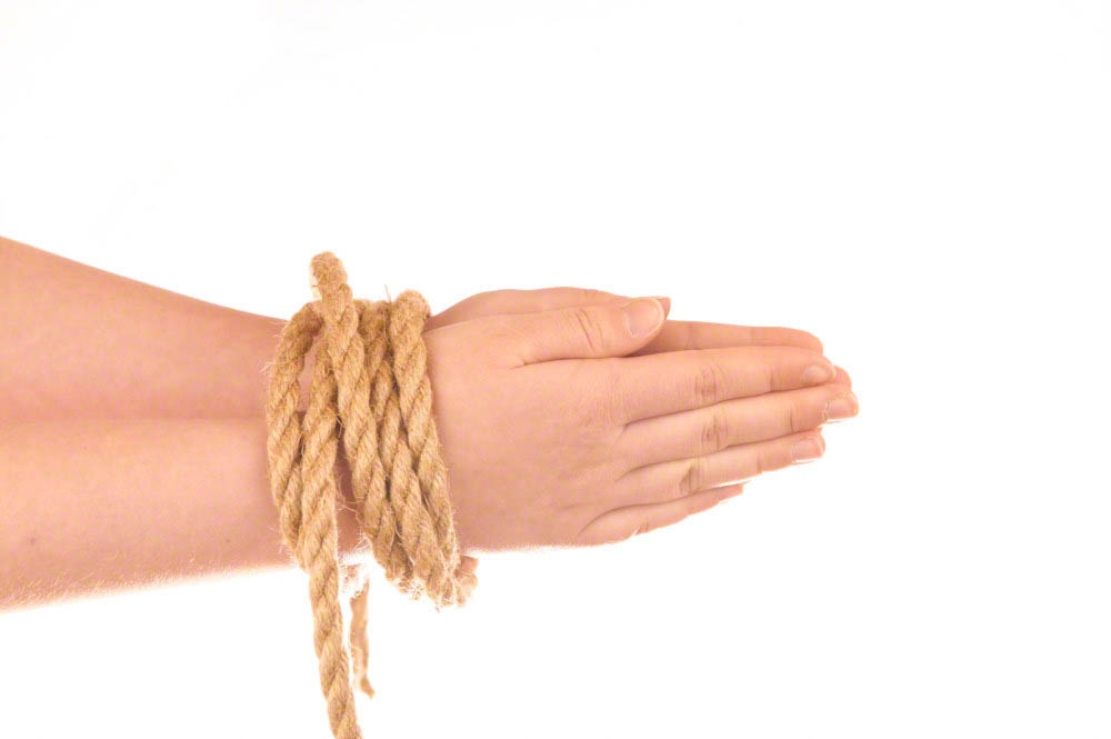 Hands tied with natural hemp