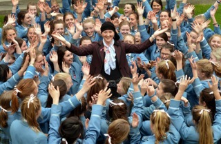 Melissa Bell surrounded by her students