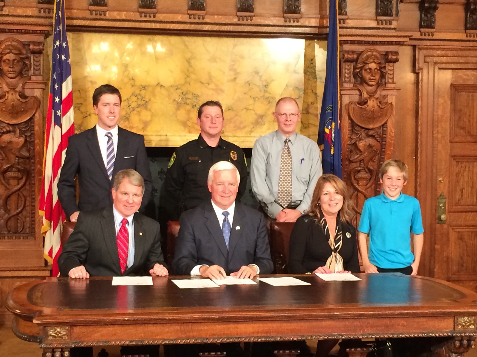 Standing from left to right is Jon Hopcraft. Lt. Matthew Johnson, David Johnson, Adyson Johnson Sitting from left to right is Senator David Argall, Governor Tom Corbett, Representative Tina Davis .