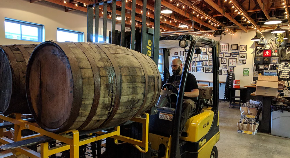 Thor taking barrels from the tasting room to the final blending