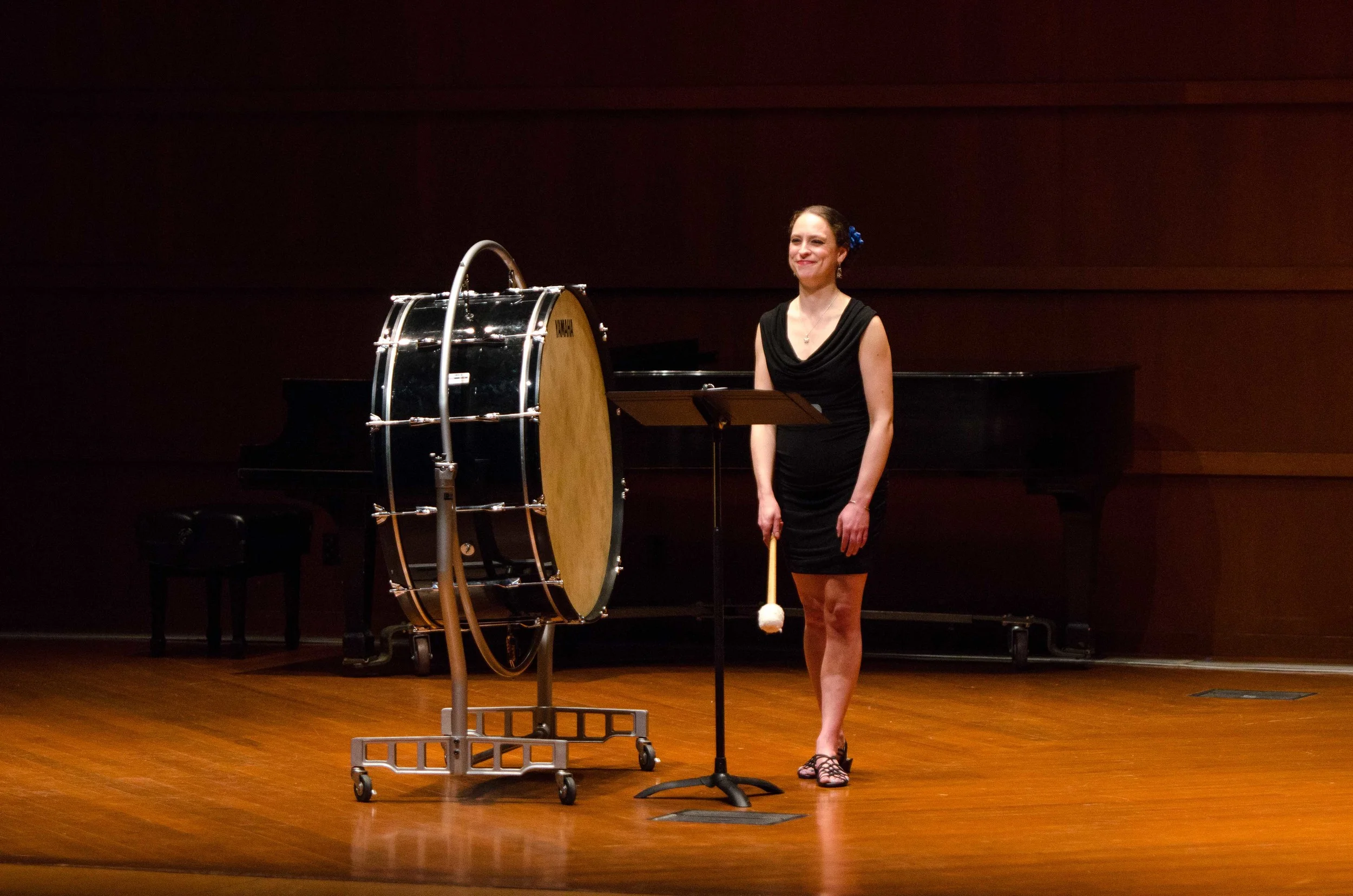 Mezzo-Soprano Lisa Neher performing a solo with bass drum.