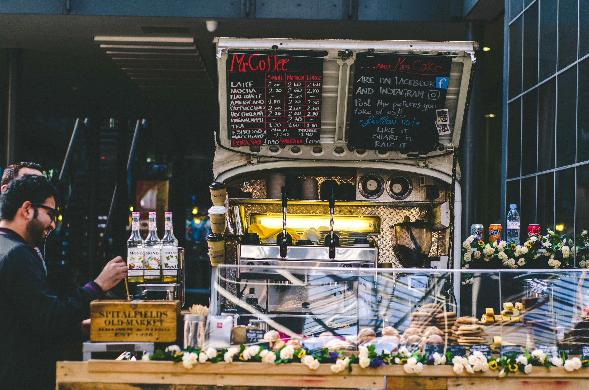 Cute coffee truck at an indoor market.