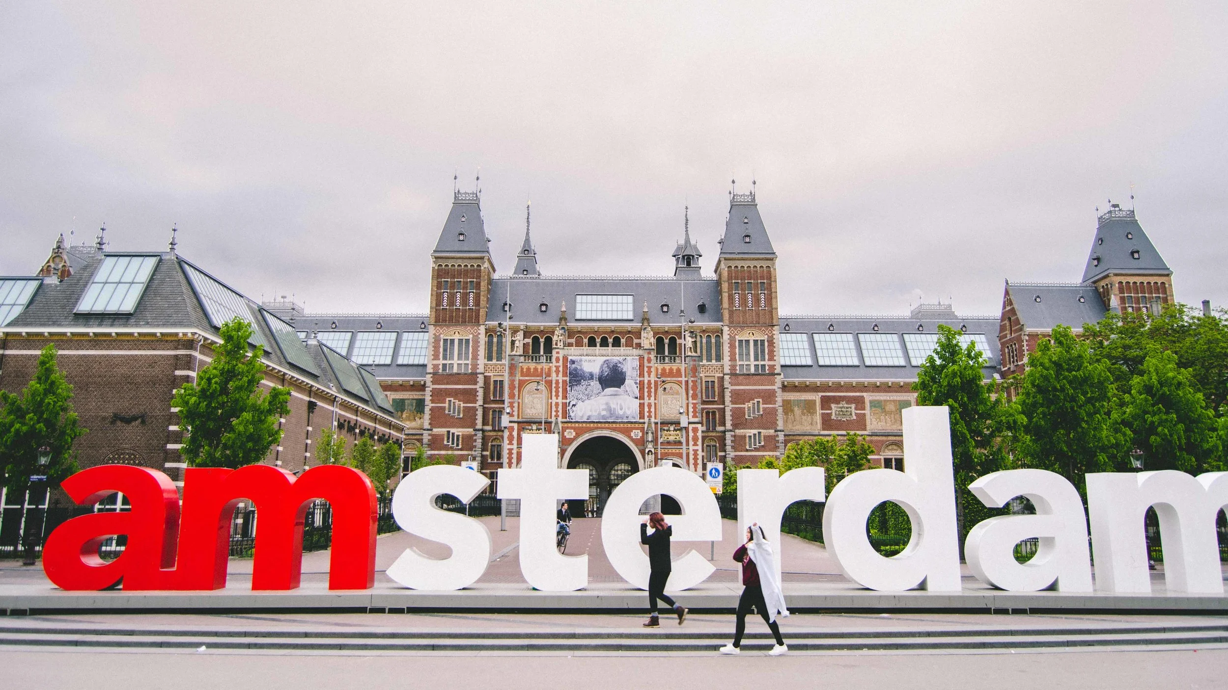 What the 'I Amsterdam' sign looks like at 6:45 in the morning. These two young women were from California and graciously took my photo before they left for the airport.
