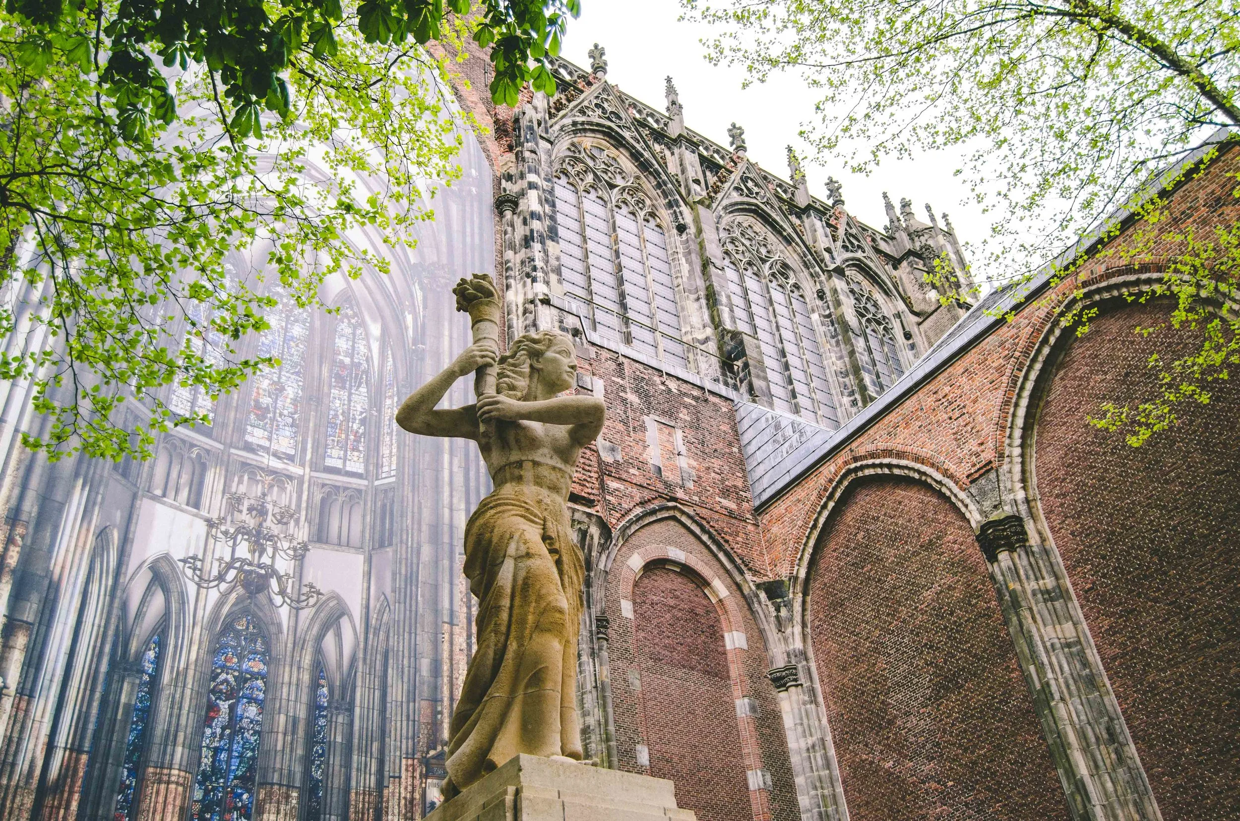 What used to be a large cathedral is now a remaining wall, spots to mark the old pillars, and a photo commemoration