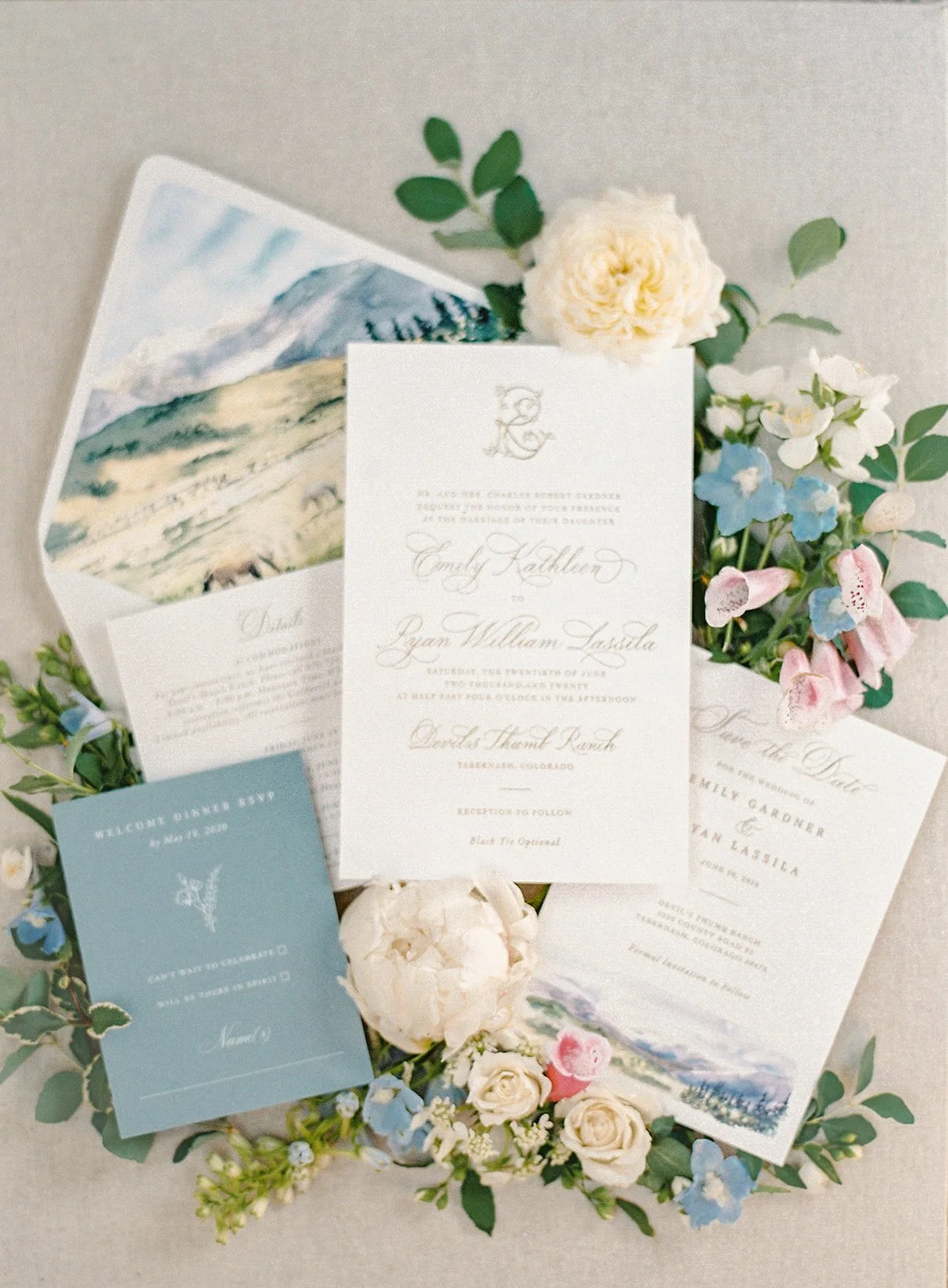 Custom wedding invitation suite with watercolor artwork inspired by Devil’s Thumb Ranch.