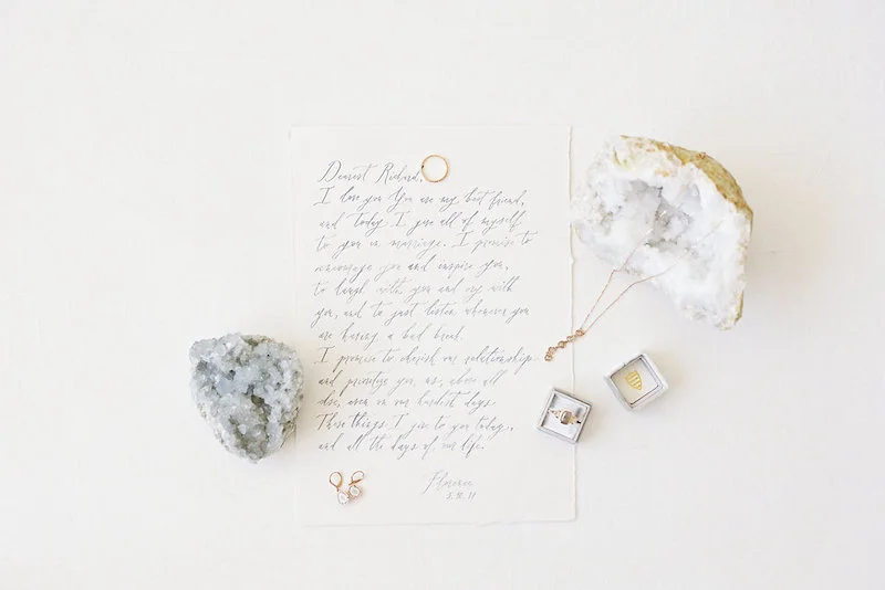Beautiful calligraphy from Ettie Kim with wedding rings and jewelry from Sarah O. Jewelry using a Mrs. Box styled by The Styled Soiree, photo by Decorus Photography