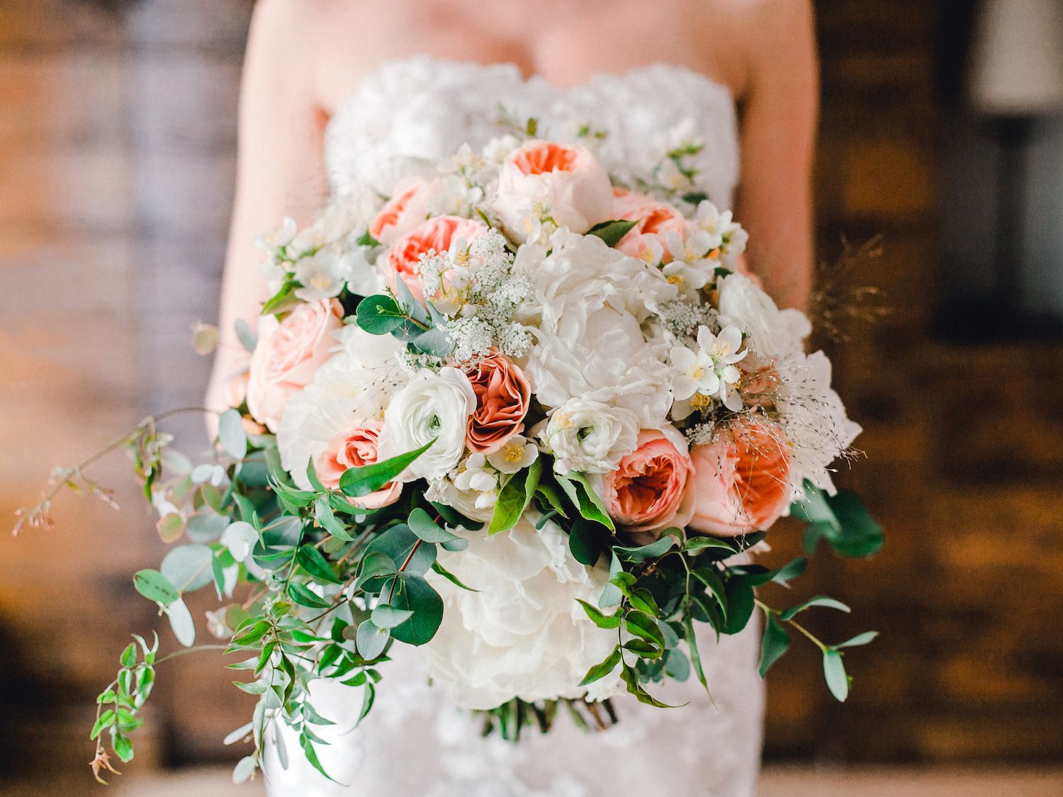 Bride's bouquet with garden roses, peonies, and hydrangeas for a summer wedding