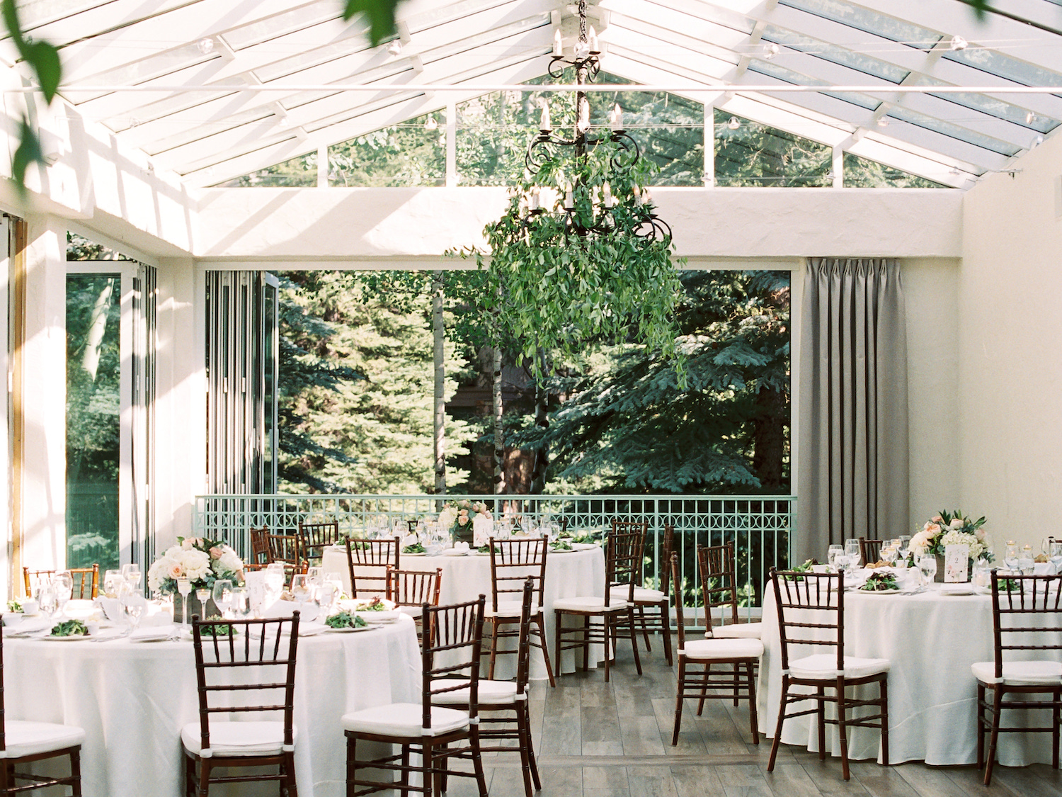 Sonnenalp wedding reception with greenery in chandeliers