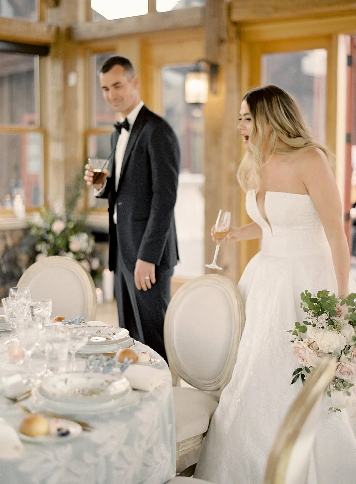 Newlyweds entering their intimate dinner reception inside Timber House.