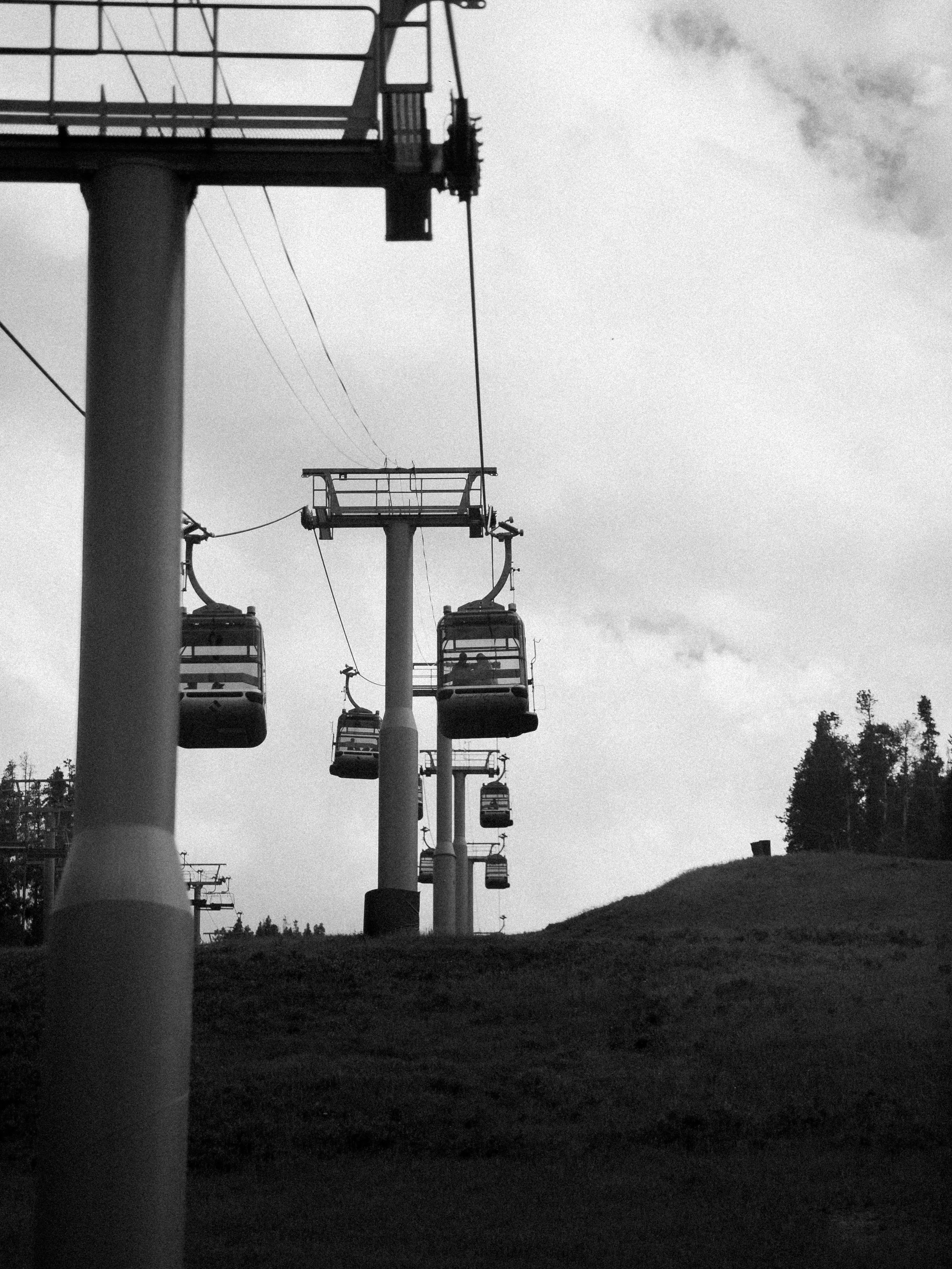 Gondolas traveling up Vail Mountain during summer in Vail, Colorado