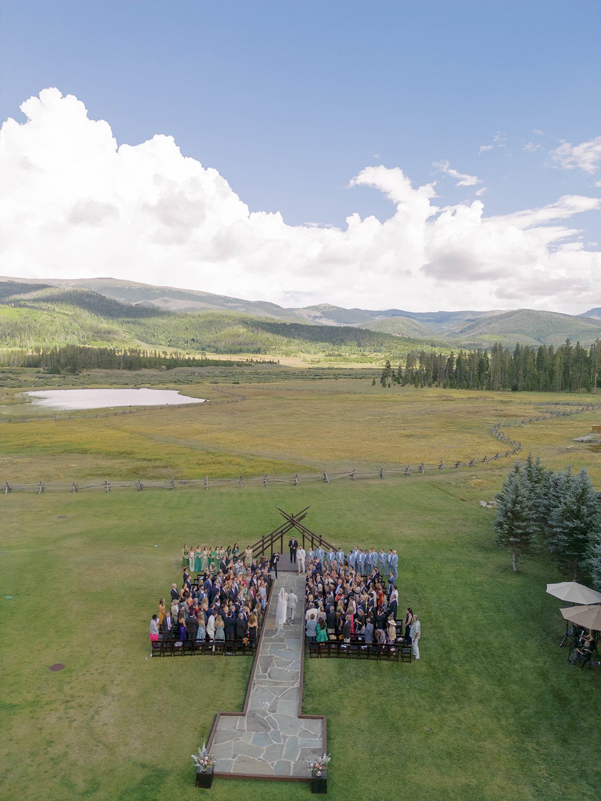 Outdoor wedding ceremony at Devil’s Thumb Ranch in Colorado with mountain views