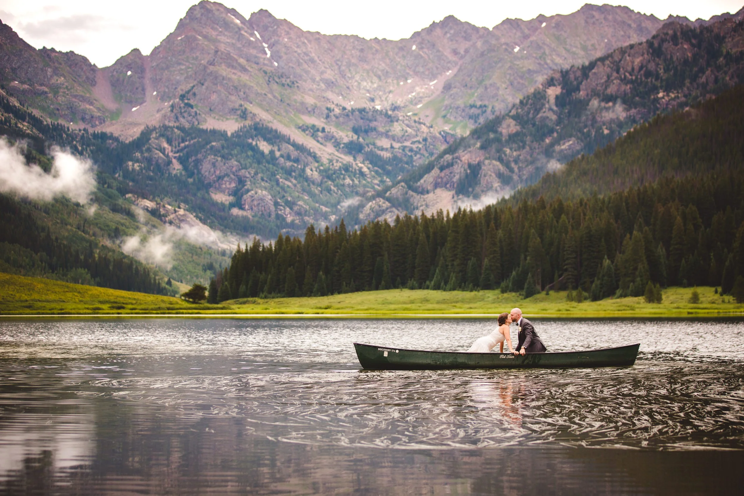 Couple in a canoe on Piney Lake during a wedding at Piney River Ranch near Vail, Colorado