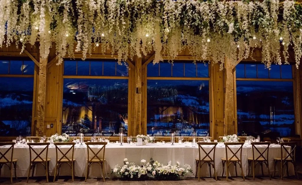 Reception setup inside High Lonesome Barn at Devil’s Thumb Ranch