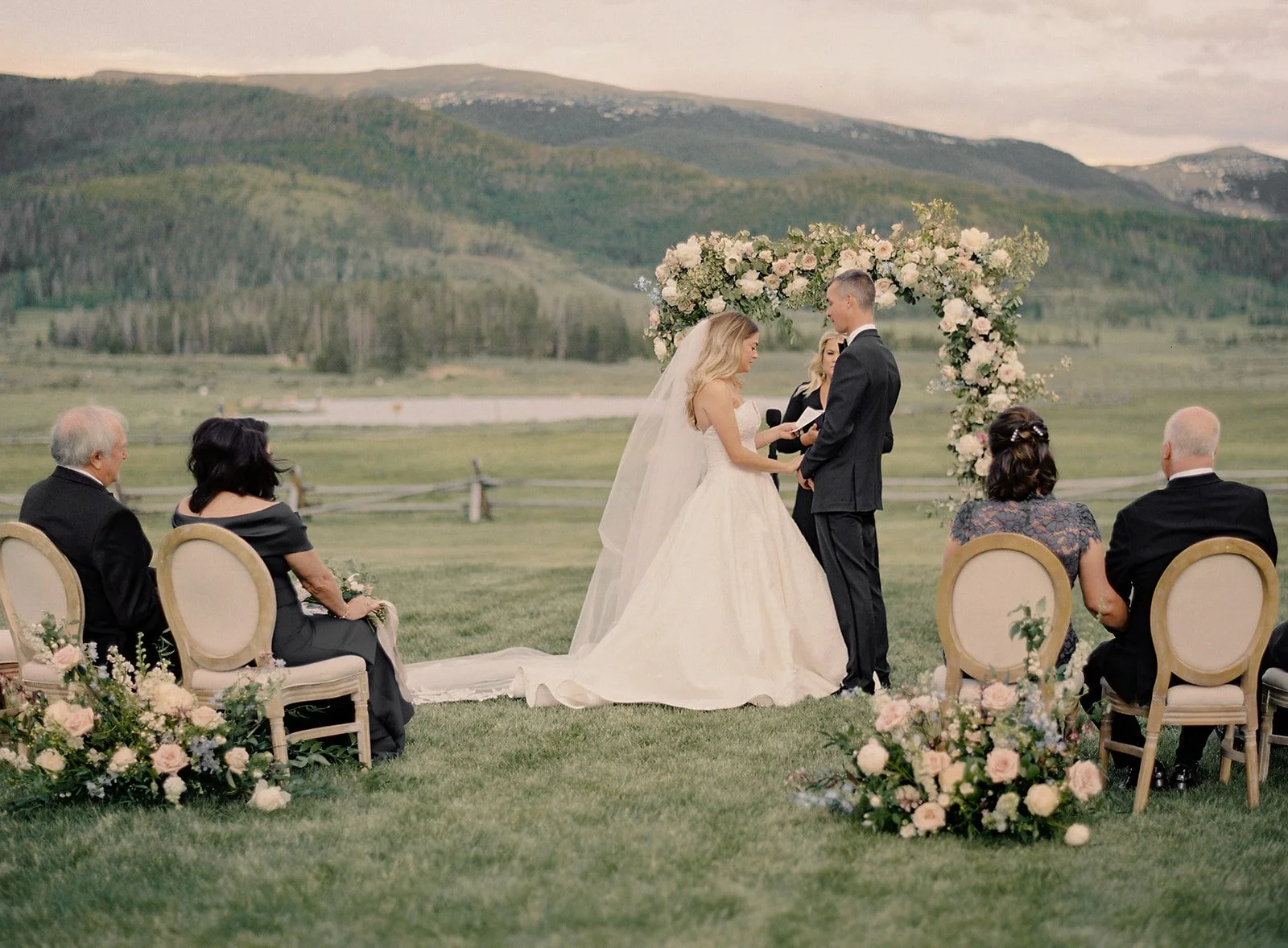 Bride and groom exchanging vows during an intimate Devil’s Thumb Ranch wedding ceremony.