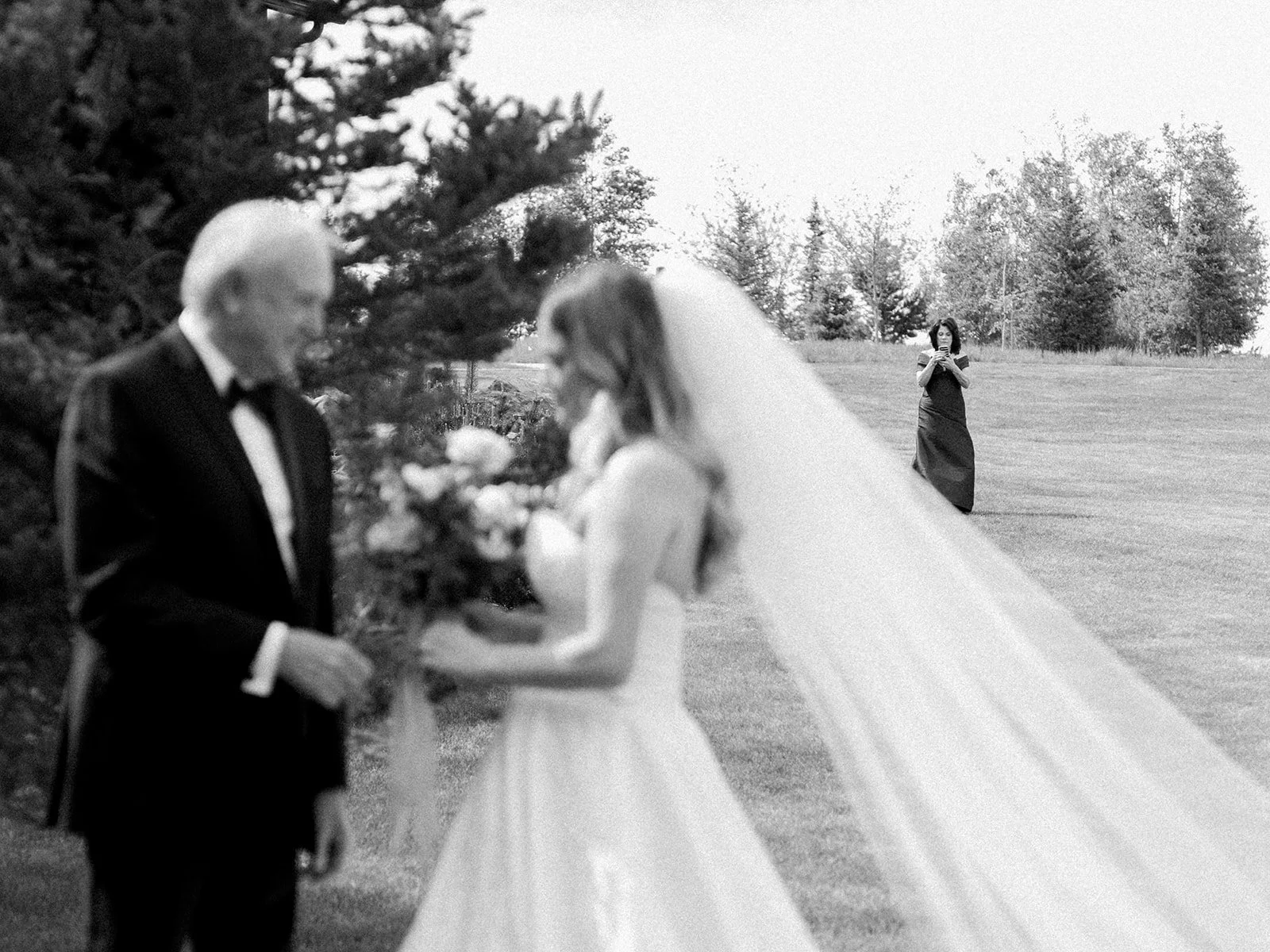Bride sharing an emotional first look with her father before the ceremony.