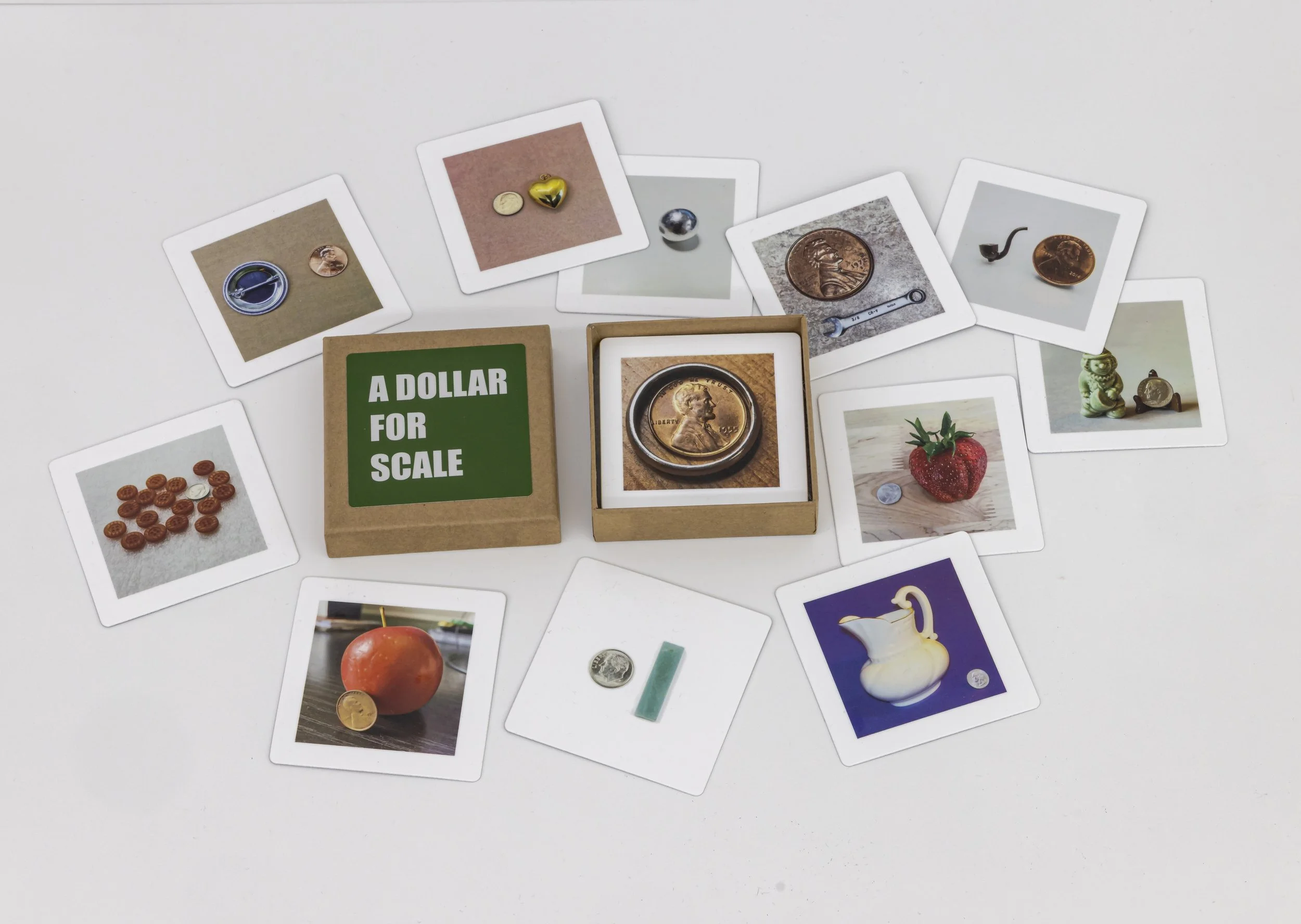 Card game comprised of found images where coins have been employed to indicate scale.