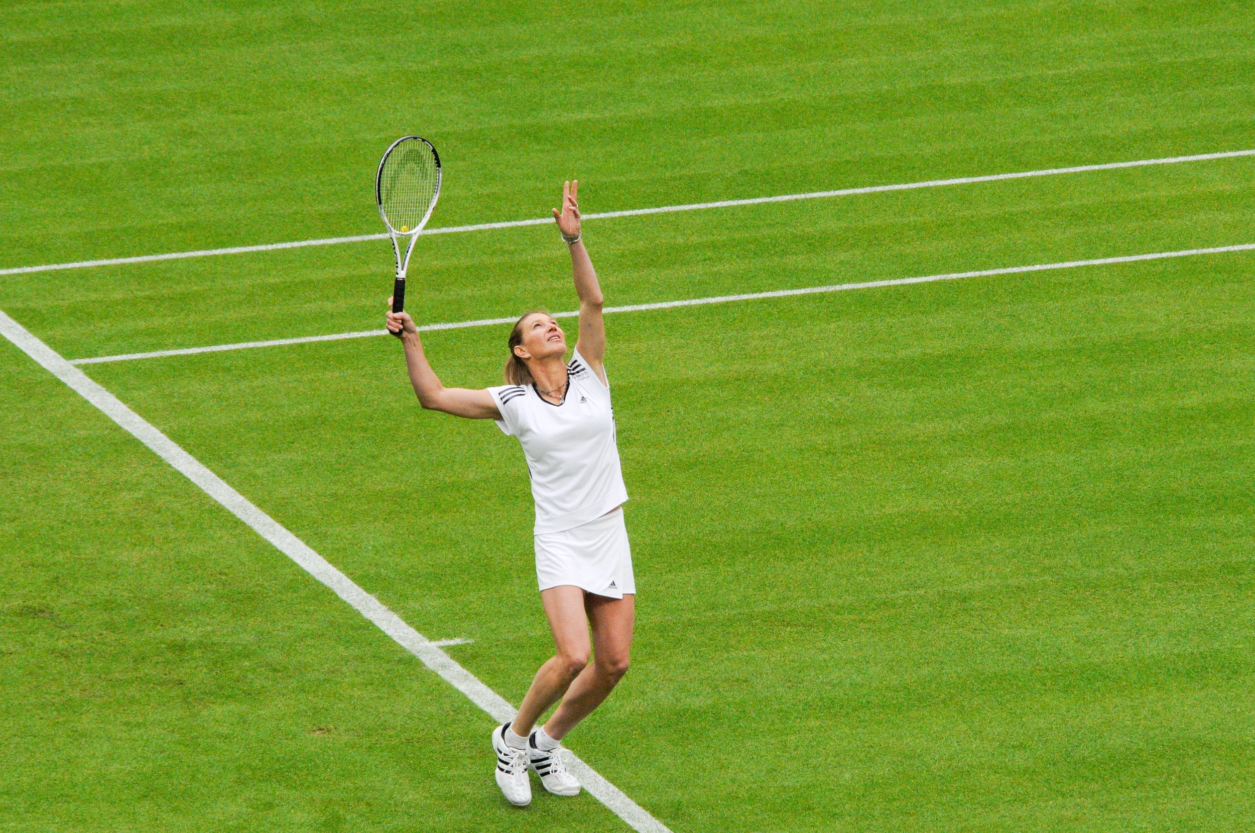 Steffi Graf serving at a special Wimbledon event, 2009. Photograph by Chris Eason.