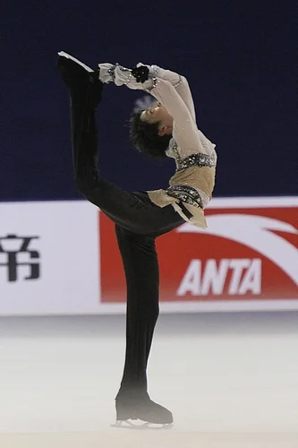 Yuzuru Hanya executing a Biellmann spin – named for Swiss skater Denise Biellmann, who popularized it – at the 2011 Cup of China. Photograph by David W. Carmichael.